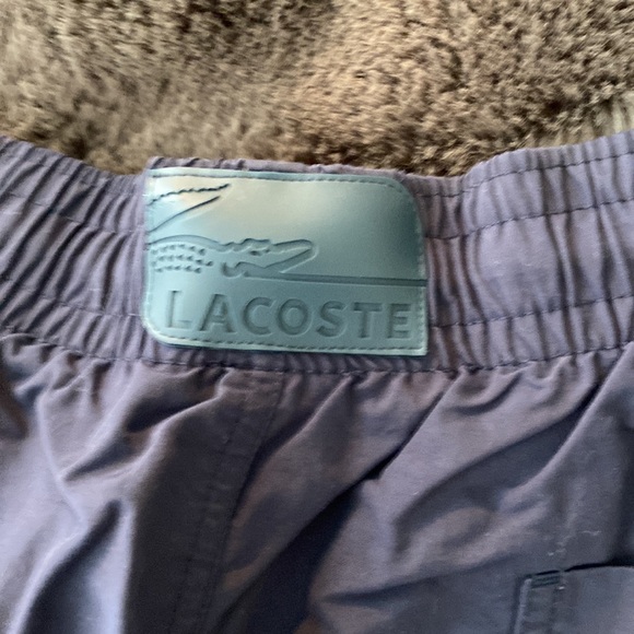 A Lacoste men’s quick-dry swim shorts with built in mesh lining. - Picture 7 of 8